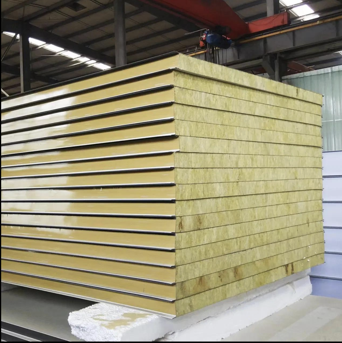 Rock wool sandwich panels stacked in a factory workshop for building wall applications